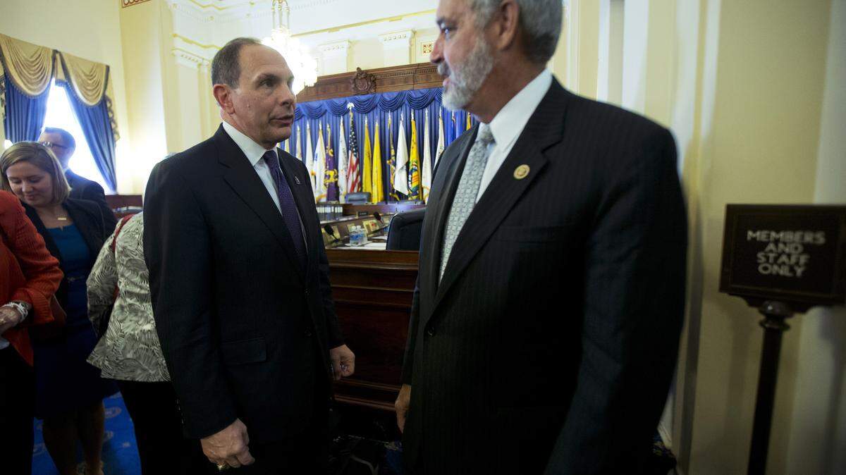 Veterans Affairs Secretary Bob McDonald, left, talks to House Veterans Affairs Committee Chairman Rep. Jeff Miller, R-Fla., on Capitol Hill in Washington, Wednesday, Oct. 7, 2015, at the conclusion of the committee's hearing on the Veterans Health Administration. (AP Photo/Manuel Balce Ceneta)