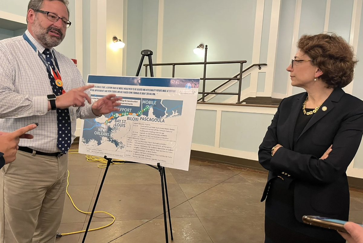 Amtrak spokesperson Marc Magliari (left) speaks with U.S. Deputy Secretary of Transportation Polly Trottenberg in Bay St. Louis Monday, Aug. 1, 2022. Trottenberg says the Biden administration is confident it will get a passenger rail in the Gulf Coast corridor.