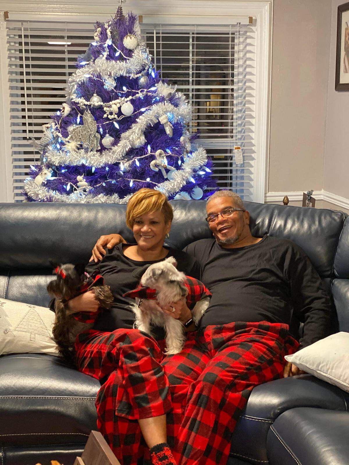 Vicki and Terry Fairley wore matching pajamas on Christmas 2019 at home in Gulfport with their two schnauzers, Alvin and Paige.