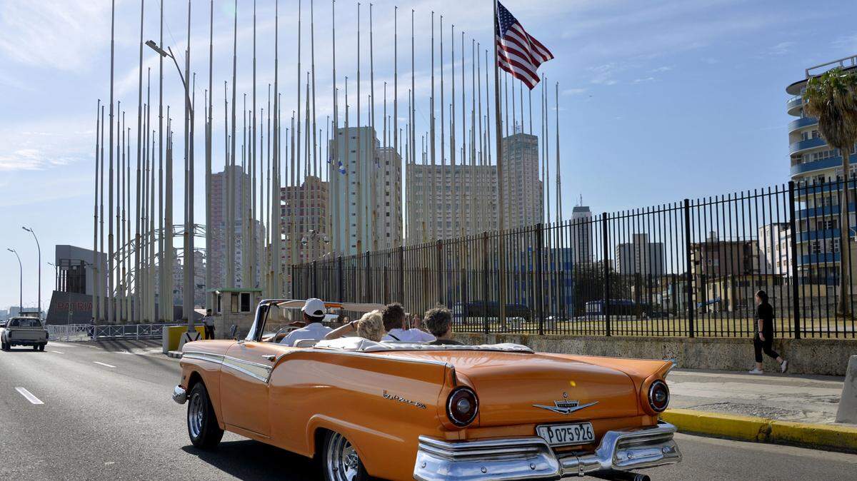 An old car passes in front of the U.S Embassy in Havana, Cuba, on March 17, 2016. U.S. President Barack Obama's planned visit to Cuba on March 21-22 makes him the first U.S. sitting president in 88 years to do so. (Olivier Douliery/Abaca Press/TNS)
