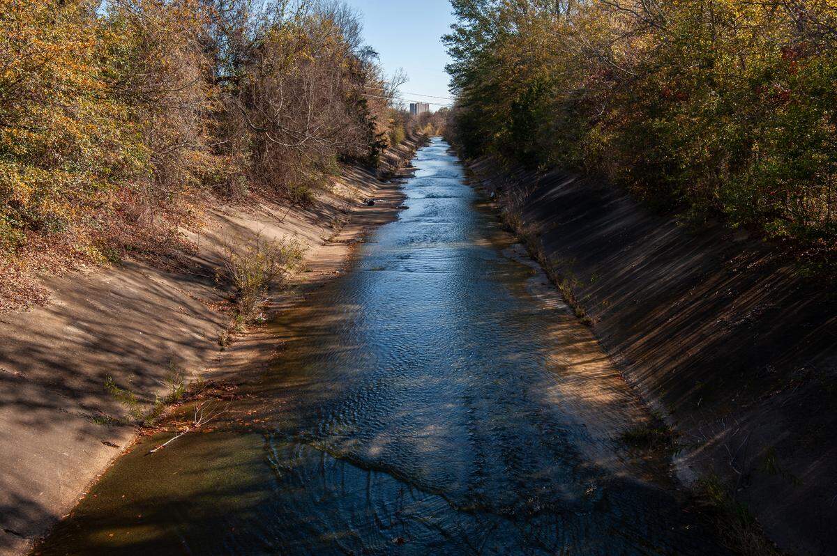 Water moves through a drainage ditch in Jackson on Dec. 18, 2023.
