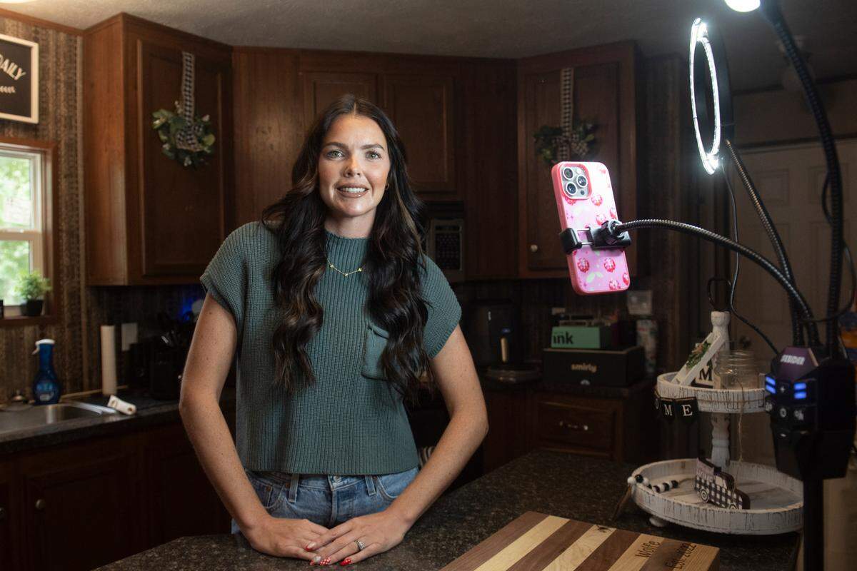 Patience Wolfe poses for a portrait at her trailer home in Vancleave on Monday, July 15, 2024. Wolfe, who goes by the handle @trailerparkpretti on TikTok and Instagram, has made a career for herself through posting about her life in a trailer.