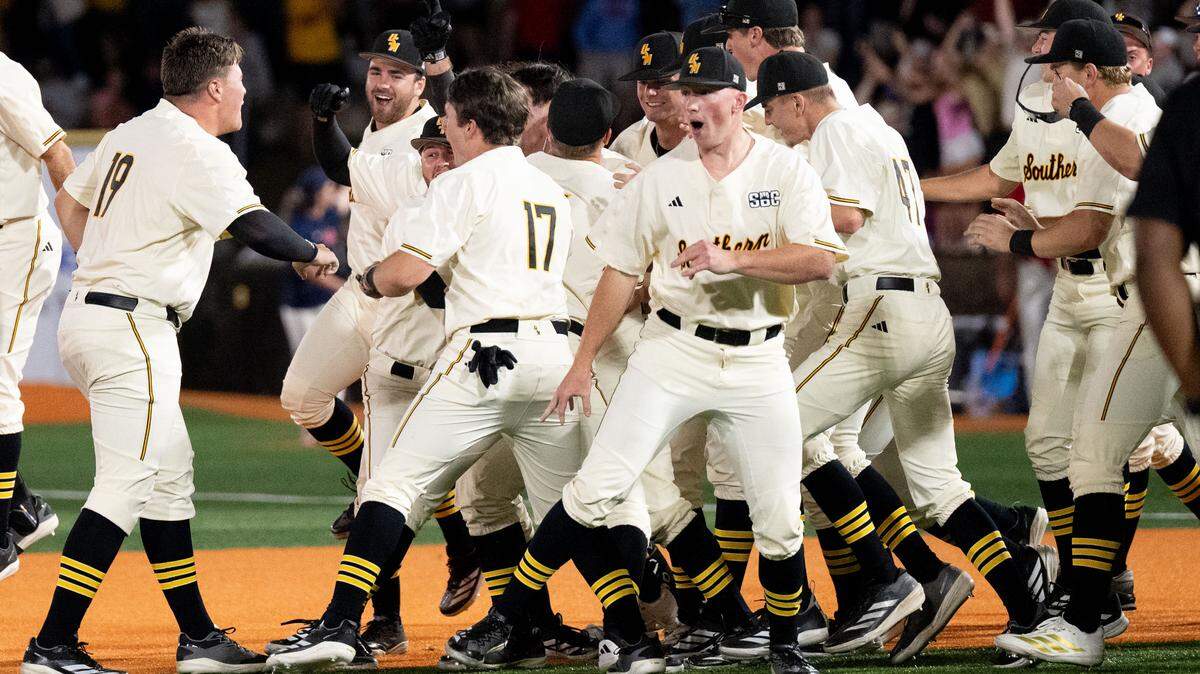 Southern Miss players celebrate a walk off score to win a baseball game at Pete Taylor Park in Hattiesburg on Tuesday, March 10, 2026.