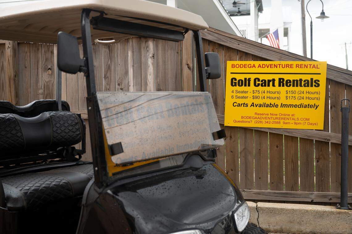 A sign advertising golf cart rentals is seen in Bay St. Louis on Sept. 25, 2025.