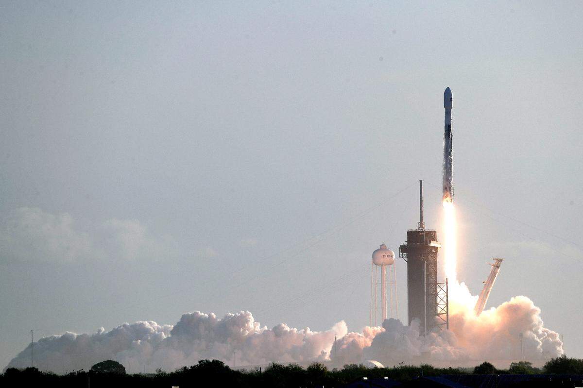 A Falcon 9 SpaceX rocket with a payload of approximately 60 satellites for SpaceX’s Starlink broadband network lifts off from pad 39A at the Kennedy Space Center in Cape Canaveral, Fla., Wednesday, March 18, 2020.