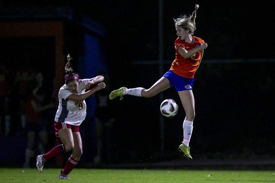Gulfport’s Chloe Brock, right, gets tripped up by the ball during a game against Biloxi at Herbert Wilson Recreation Center in Gulfport on Tuesday, Dec. 14, 2021.