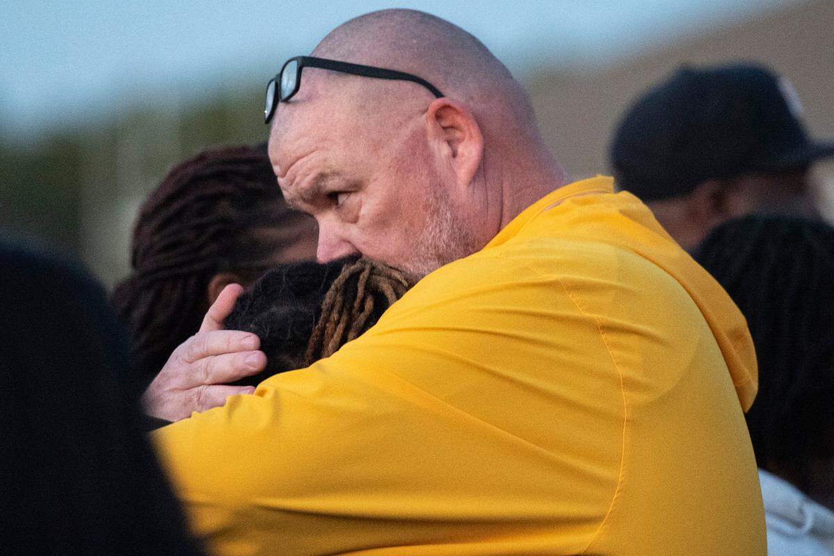 Gautier football coach Marc High hugs Shermarion Miner’s mother after a vigil for the Gautier High School student and football player at Gautier High School on Thursday, Jan. 16, 2025. Miner died suddenly after working out in the high school field house.