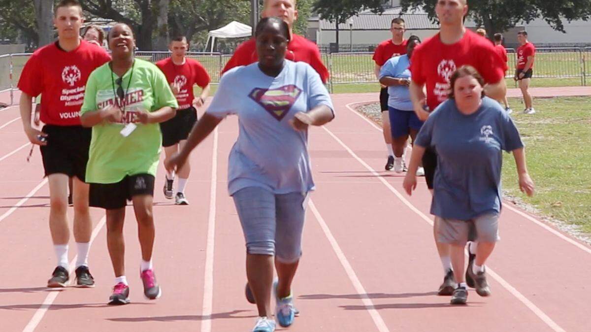 JOHN FITZHUGH/SUN HERALD 
 Athletes compete in the 100-meter walk during the 2016 Mississippi Special Olympics Summer Games at Keesler Air Force Base in Biloxi on Saturday May 21, 2016.