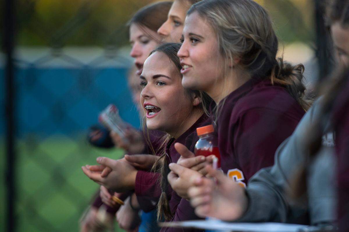 Members of the George County softball team cheer for their teammates during a game at St. Martin on Monday, March 20, 2023.