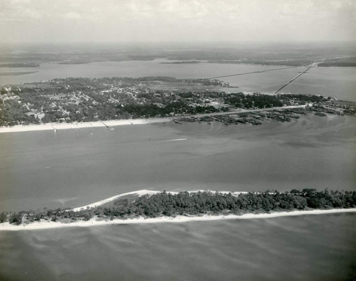 Deer Island, shown here in a rare circa 1950s aerial, is near Biloxi’s mainland and is filled with legends and rumors, including that it once hosted a mid-20th Century nudist colony. (Credit: Audrey Murphy Collection/Harrison County Library System)