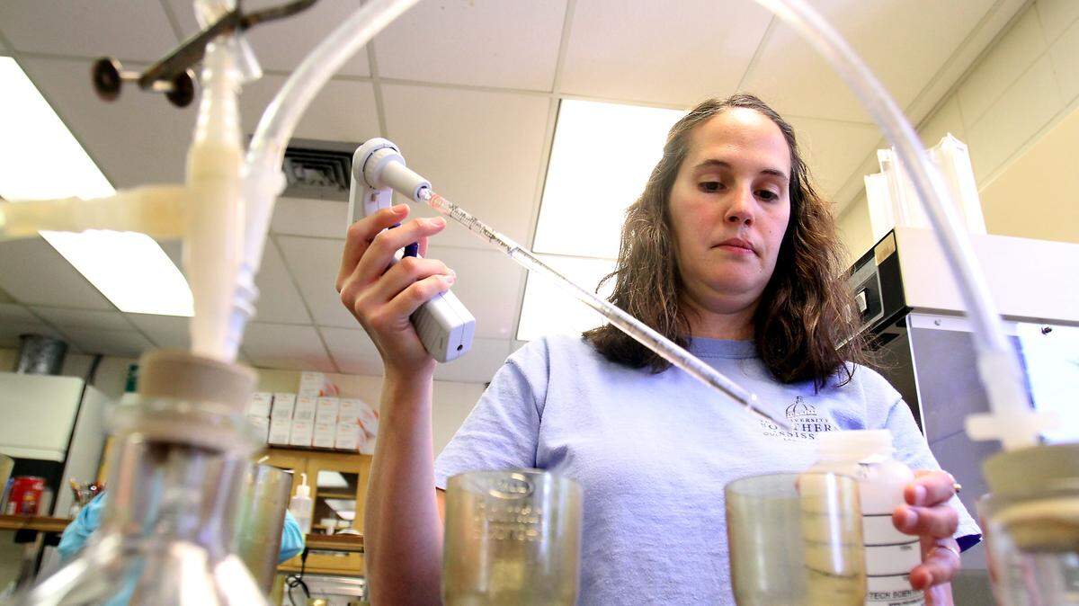 AMANDA McCOY/SUN HERALD/FILE 
 Misty Fiello, research technician with the Southern Miss Gulf Coast Research Lab, tests samples from the beach for enterococci bacteria at GCRL in 2011. The Gulf Coast Research Lab in Ocean Springs will use an increase in research funding to study fisheries, marine resources, wetlands, marshes, marine diseases, oysters and oyster-culturing.