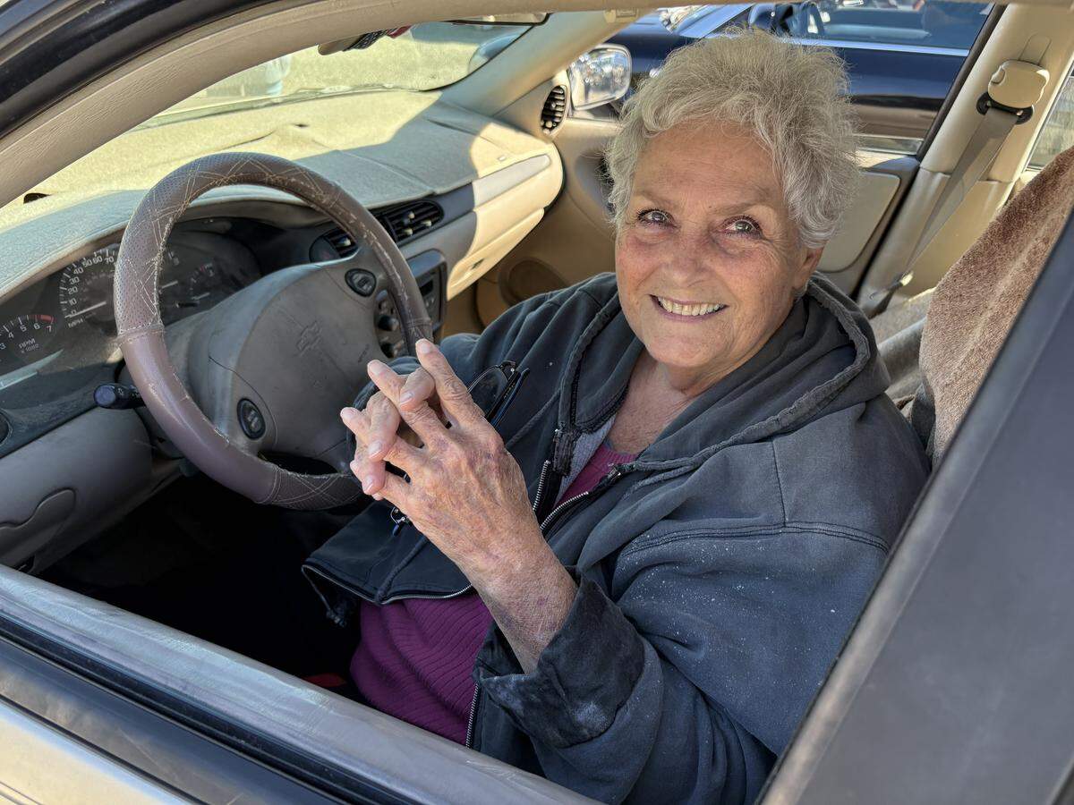 Jewel Rothery, 75, of Gulfport said she has been struggling to make ends meet. She was one of many elderly people in line at a food giveaway Friday at Good Deeds Community Center in Gulfport. Rothery, who has cancer but is looking for a job, says insurance premiums eat up a good bit of her monthly retirement and disability checks. Federal benefits offered for food ended Oct. 31 because of the government shutdown.