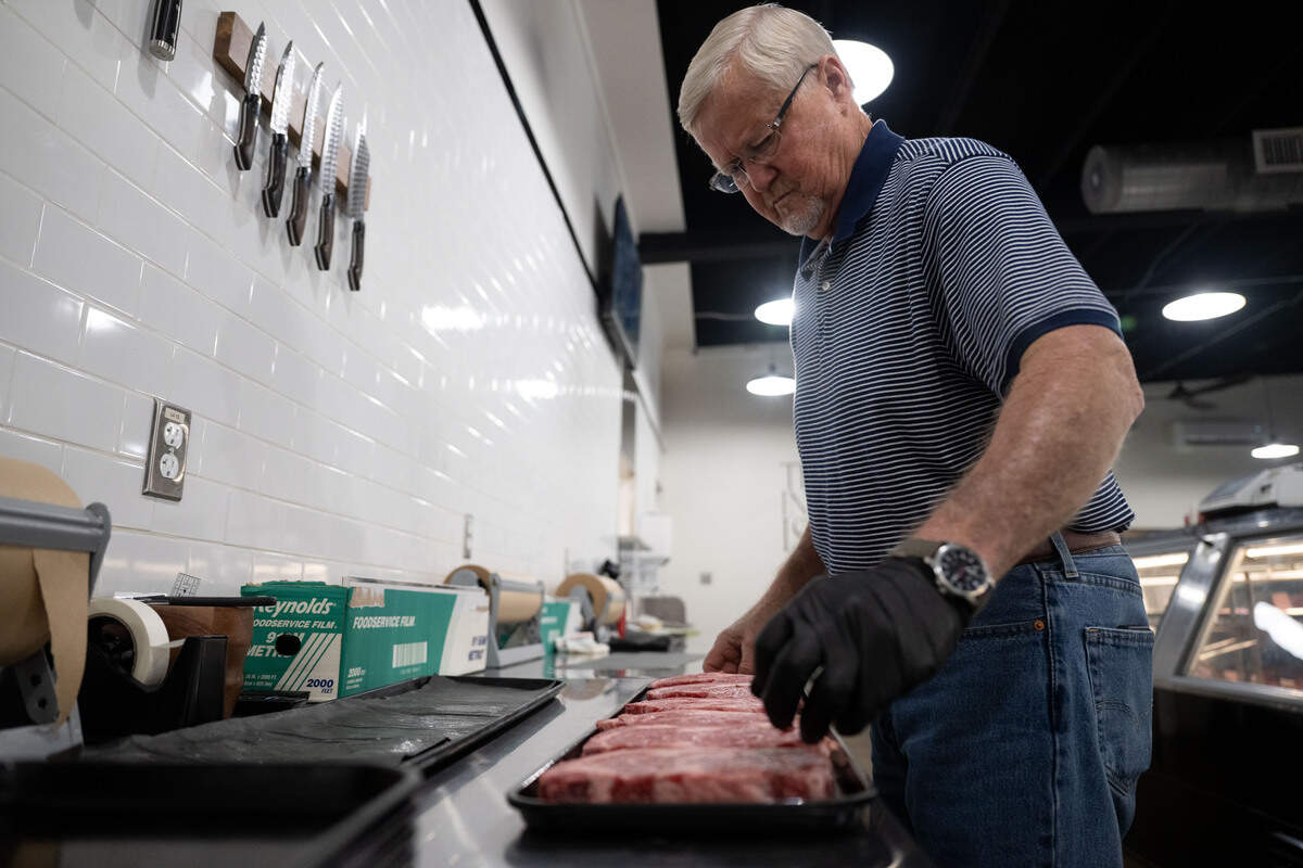 Gil Tynes prepares steaks at Johnny Pizmo’s Butchery and Marketplace in Gulfport.