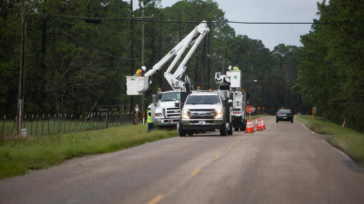 Power crews work on a damaged line on Kiln-DeLisle Road in Kiln after outages from Hurricane Ida on Aug. 30, 2021. A tornado and severe weather knocked out power in Moss Point and Gautier on June 19, 2023.
