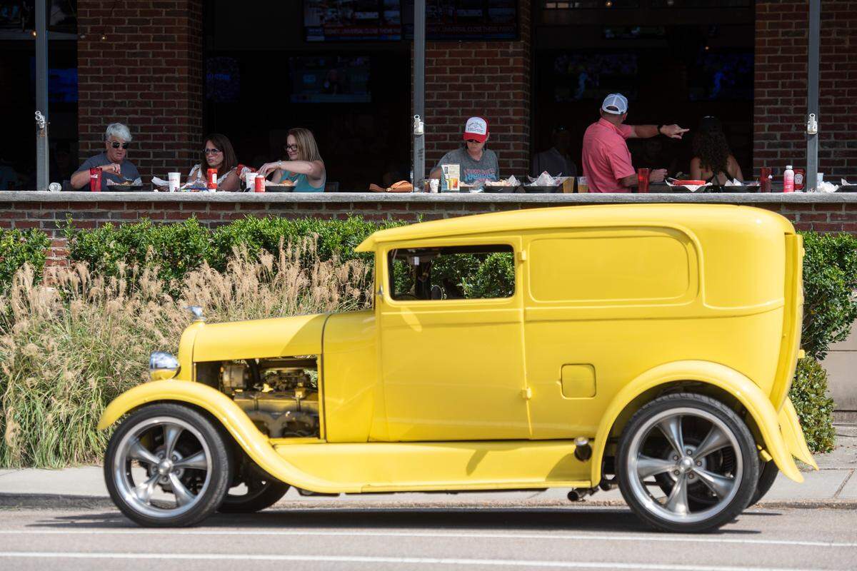 Spectators dine at Mugshots in Biloxi during the Biloxi Block Party, a Cruisin’ The Coast event in 2024. There are all kinds of vantage points to see the cars and enjoy the great food in South Mississippi.