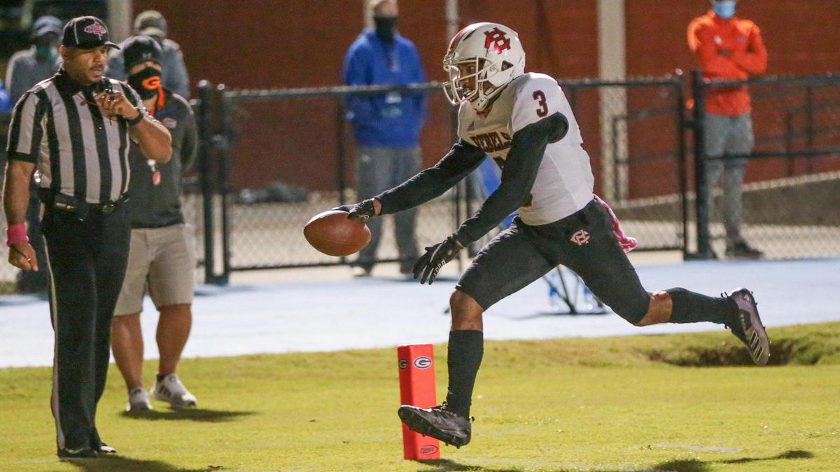 Harrison Central Isaiah Atkins (3) scores during the game between Harrison Central and Gulfport, Friday, October 16, 2020.