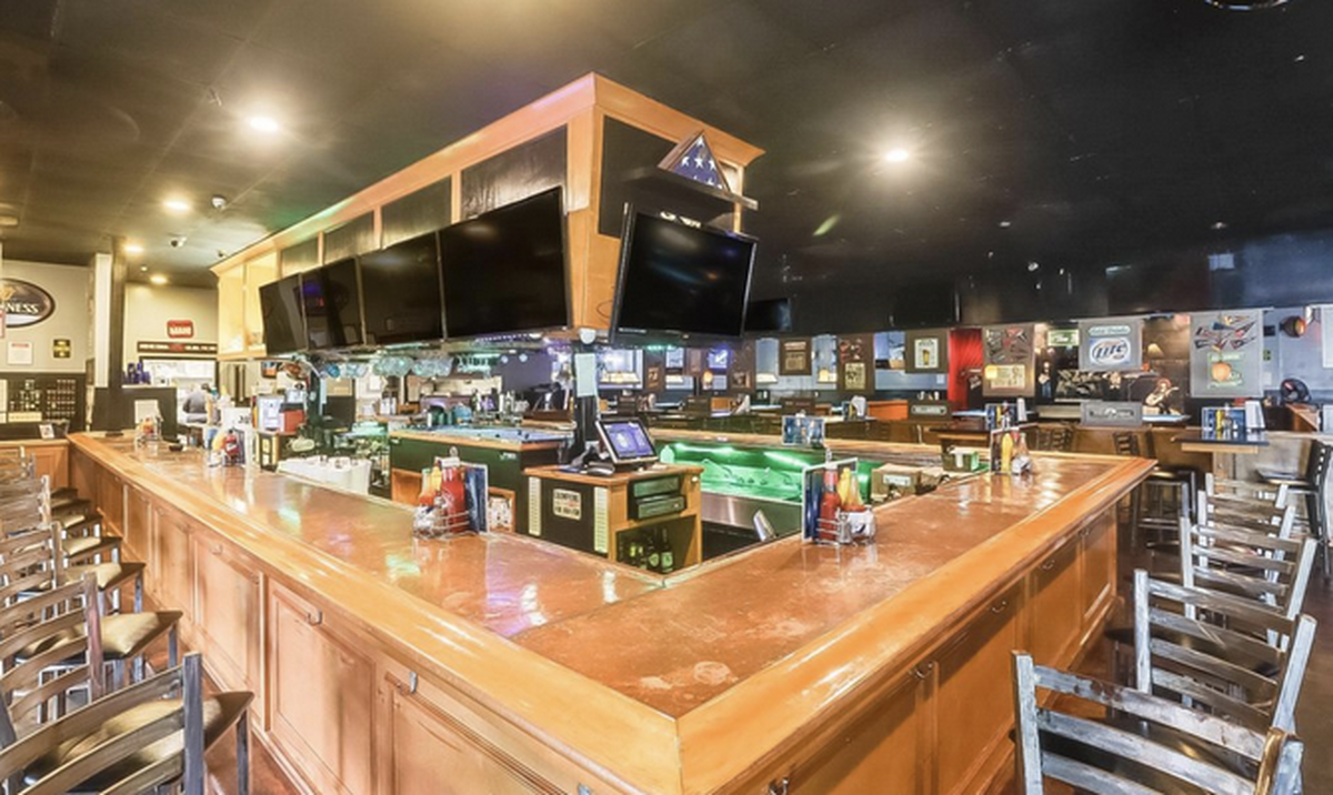 A wrap-around bar with several televisions is part of Susie Cue’s in Gulfport.