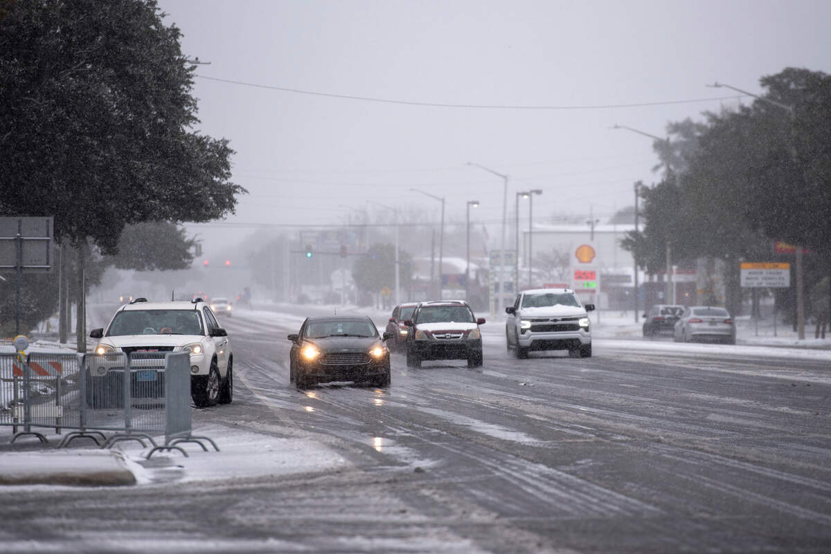 Cars drive along Highway 90 in Ocean Springs during a winter storm on the Mississippi Coast on Tuesday, Jan. 21, 2025.