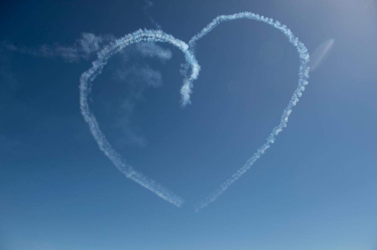 The U.S. Air Force Thunderbirds make a heart with their smoke trails during a practice for the Thunder Over the Sound airshow on Friday, April 28, 2023.
