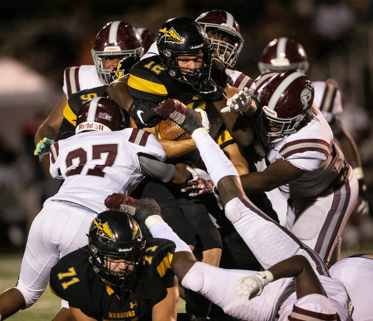 D’Iberville’s Colton Deshazo is tackled by Picayune as he carries the ball down the field during the D’Iberville versus Picayune game at D’Iberville Stadium on Friday, Sept. 17, 2021.