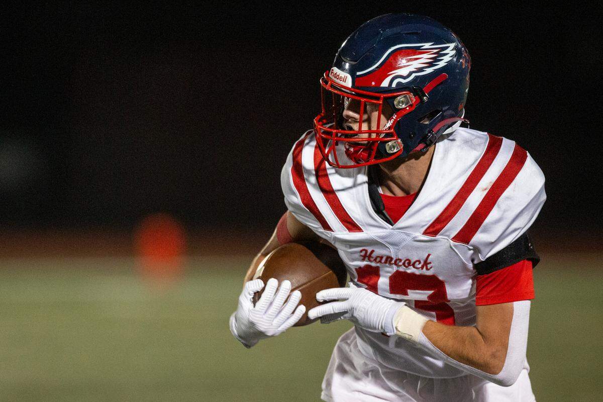 Hancock’s Todd Dedeaux catches a pass during a game at West Harrison High School in Harrison County on Friday, Oct. 6, 2023.