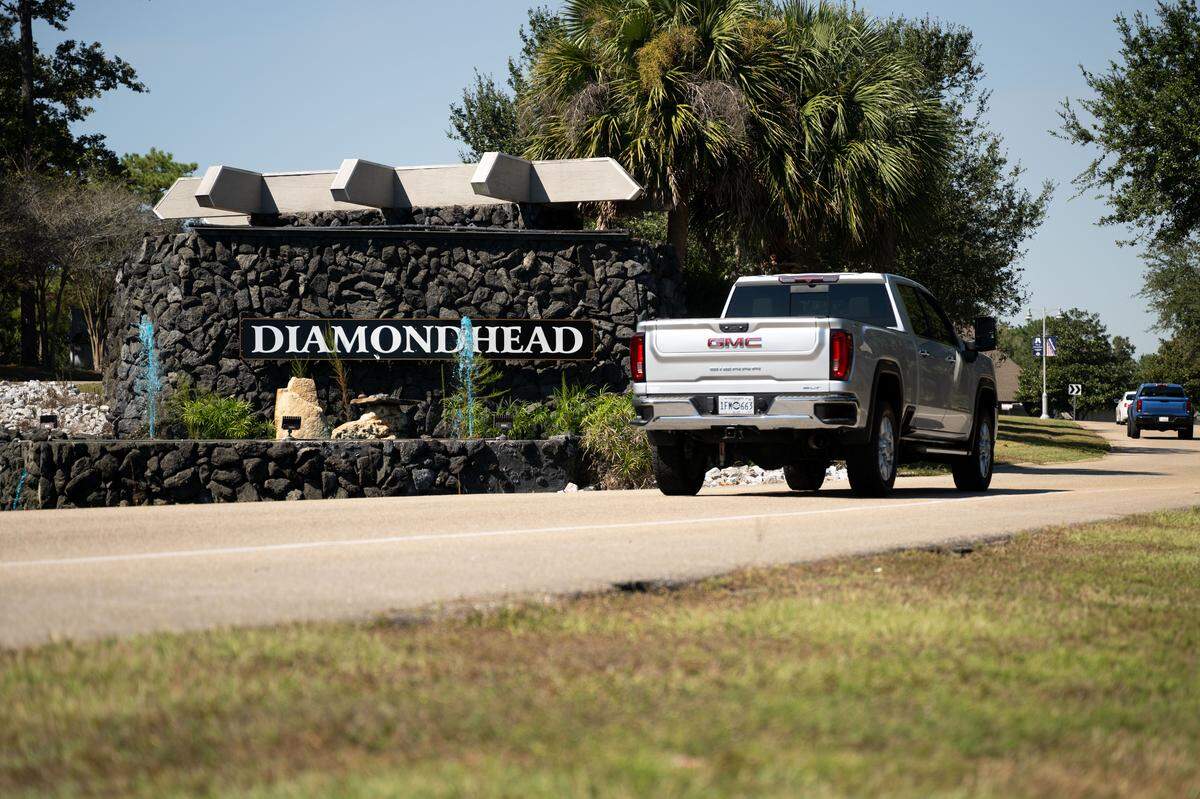 Cars drive into Diamondhead on Tuesday, Oct. 14, 2025. The community is confronting a new dilemma this fall because its influential Property Owners Association can no longer afford all of its landmark amenities. 