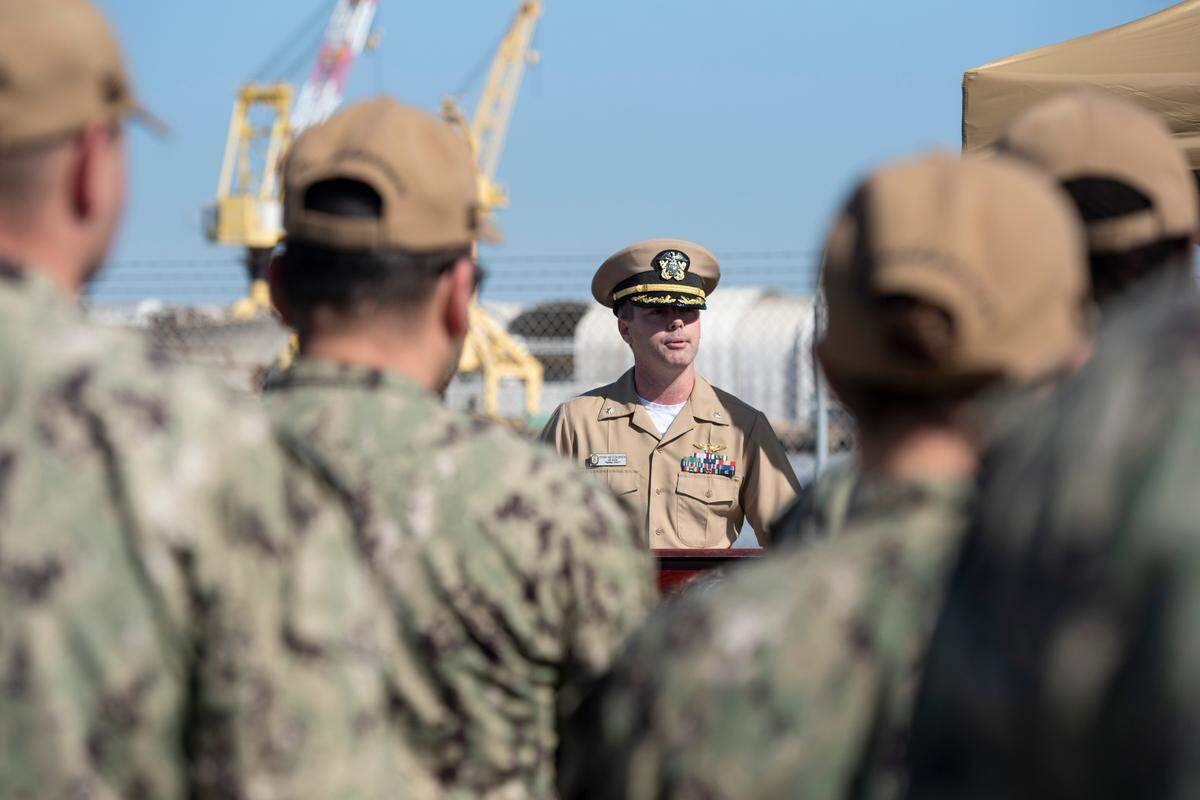 Commander Ryan McGoldrick gives a speech about WWII veteran Alfred Lewis during a ceremony in honor of Lewis and the Iwo Jima anniversary at Singing River Island in Pascagoula on Saturday, March 22, 2025.