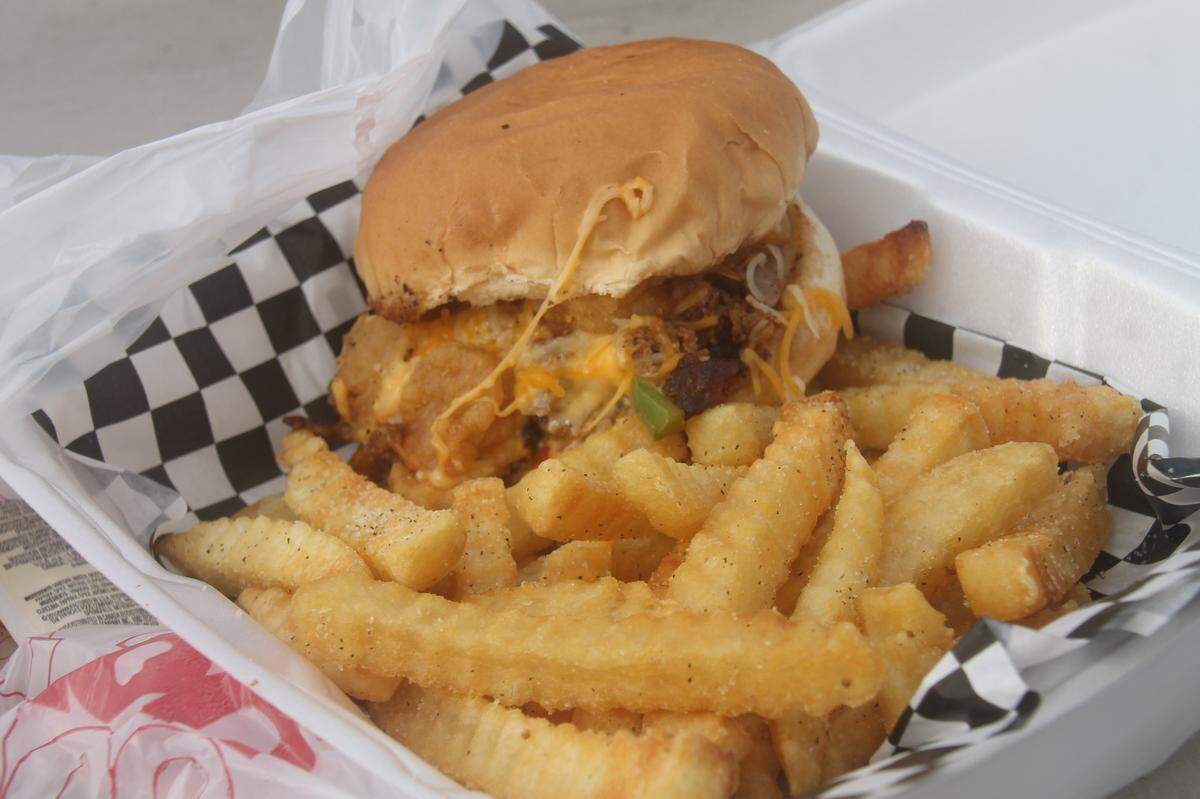 The B-Town Bomb, a delicious combination of chopped steak, fried shrimp, cheese and a cheese sauce, grilled onions and peppers.