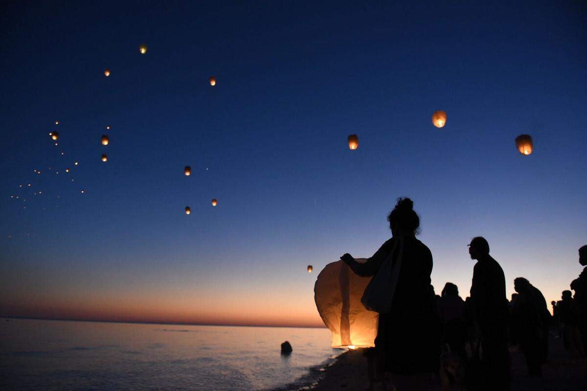 Dozens released lanterns in Henderson Point on Tuesday, Nov. 2, 2021, after the funeral service of Abby Bosarge, a Pass Christian teen who died of leukemia