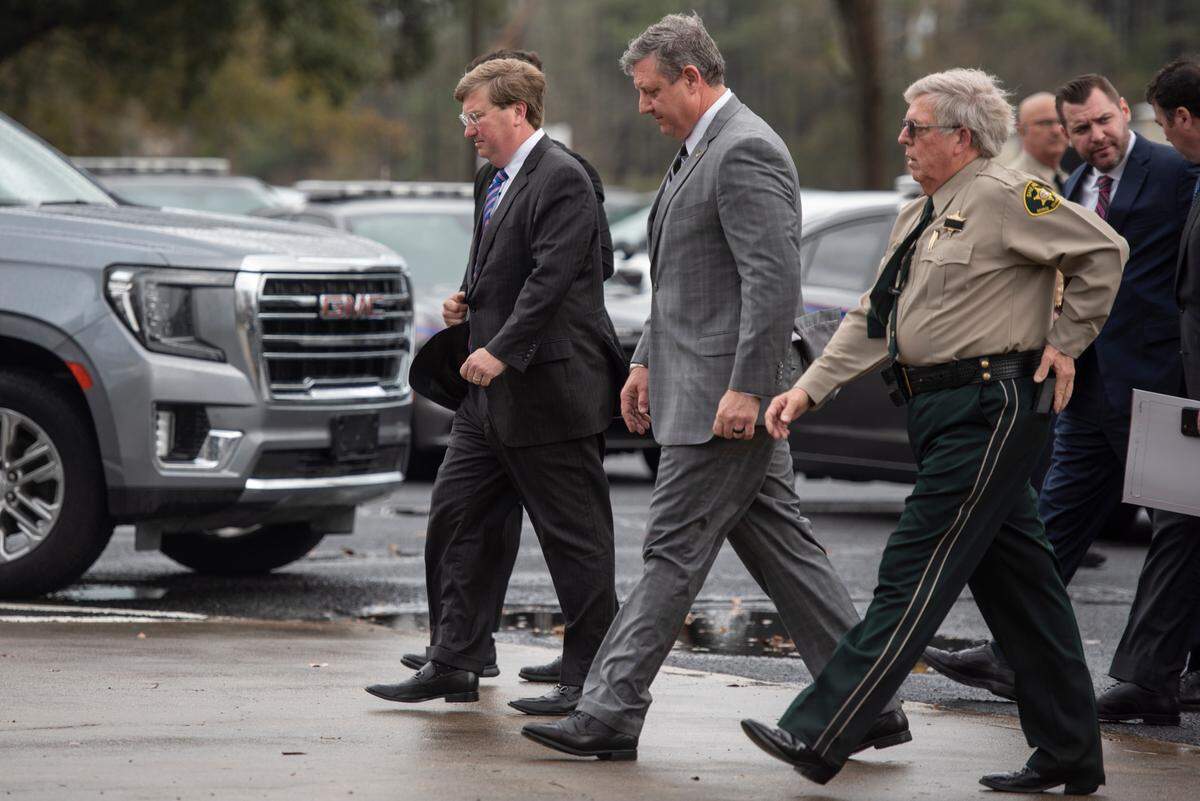 Mississippi Governor Tate Reeves, left, arrives at Agricola Baptist Church in George County for the funeral of George County Sheriff’s Deputy Jeremy Malone on Friday, Jan. 12, 2024.