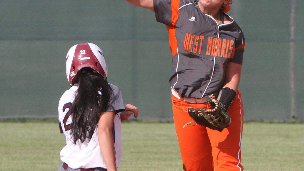 JOHN FITZHUGH/SUN HERALD 
 West Harrison shortstop Rebbeca Cuevas throws to first after forcing out Picayune's Alyssa Pinero during the sixth inning of their 5A softball playoff game at West Harrison on Friday April 29, 2016.