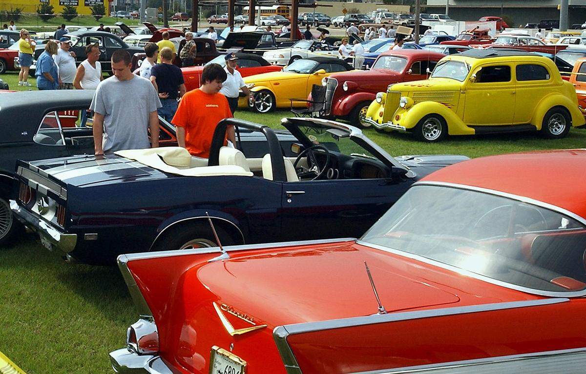Spectators check out vehicles during Cruisin’ The Coast 2002 at Jones Park in Gulfport. Cruise Central returns to Jones Park this year and several new events are on the schedule.