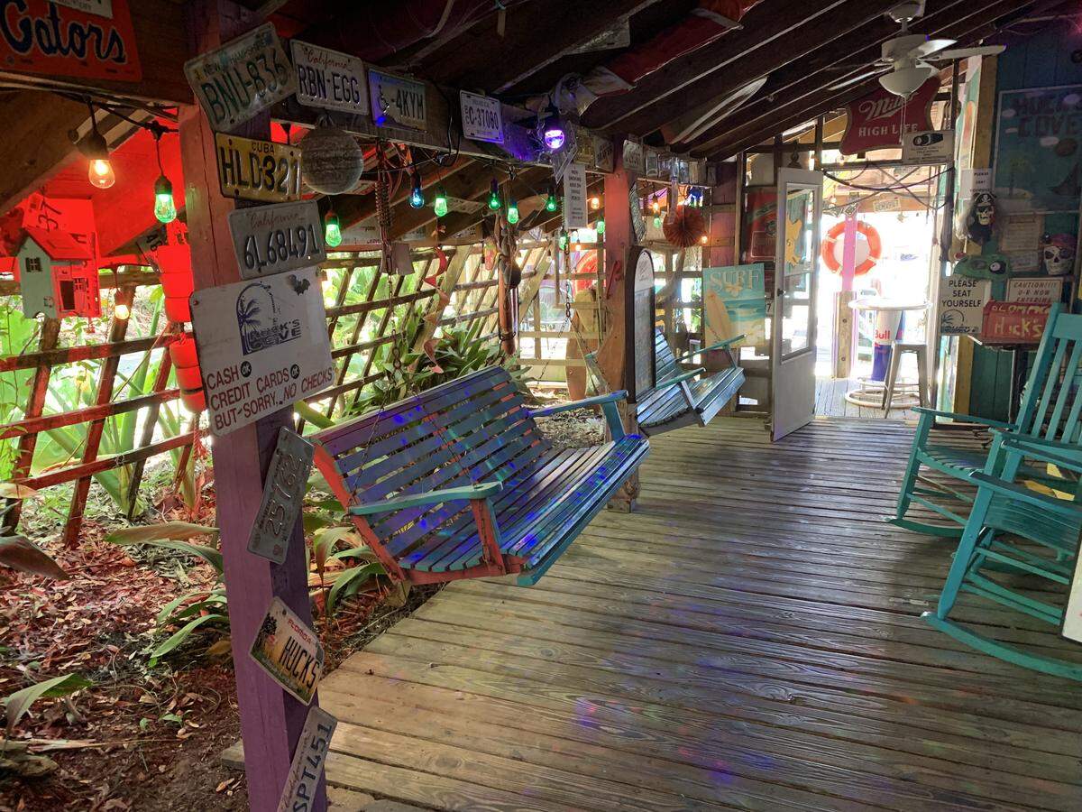 A touch of the Caribbean greets customers at Huck’s Cove in Gautier, where porch swings and rocking chairs provide a fun place to sit while waiting for a table or after dinner.