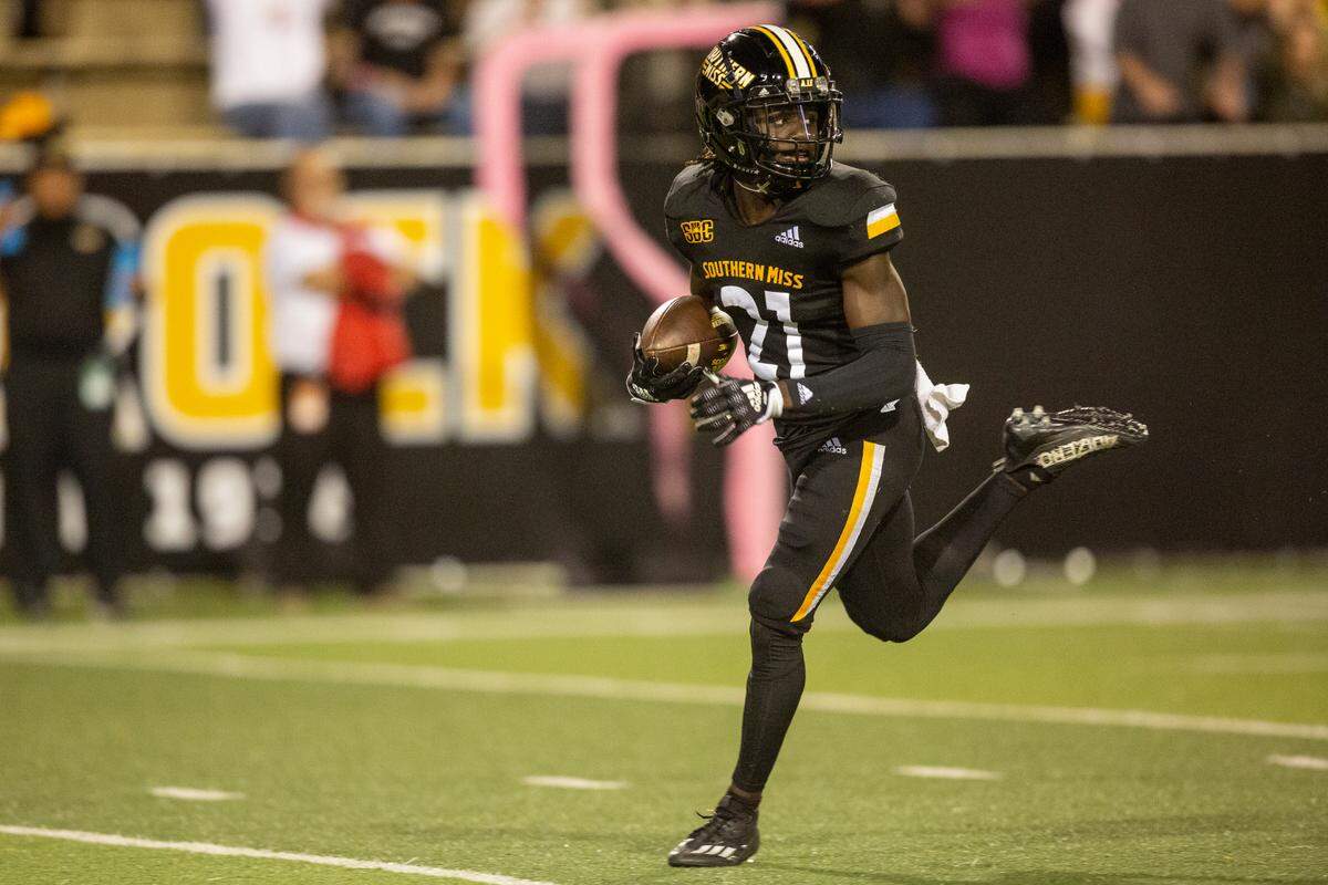 Southern Mississippi wide receiver Tiaquelin Mims (21) looks over his shoulder as he runs the ball down the field for a touchdown during the second half of an NCAA college football game in Hattiesburg, Miss., Thursday, Oct. 27, 2022. (Hannah Ruhoff/The Sun Herald via AP)