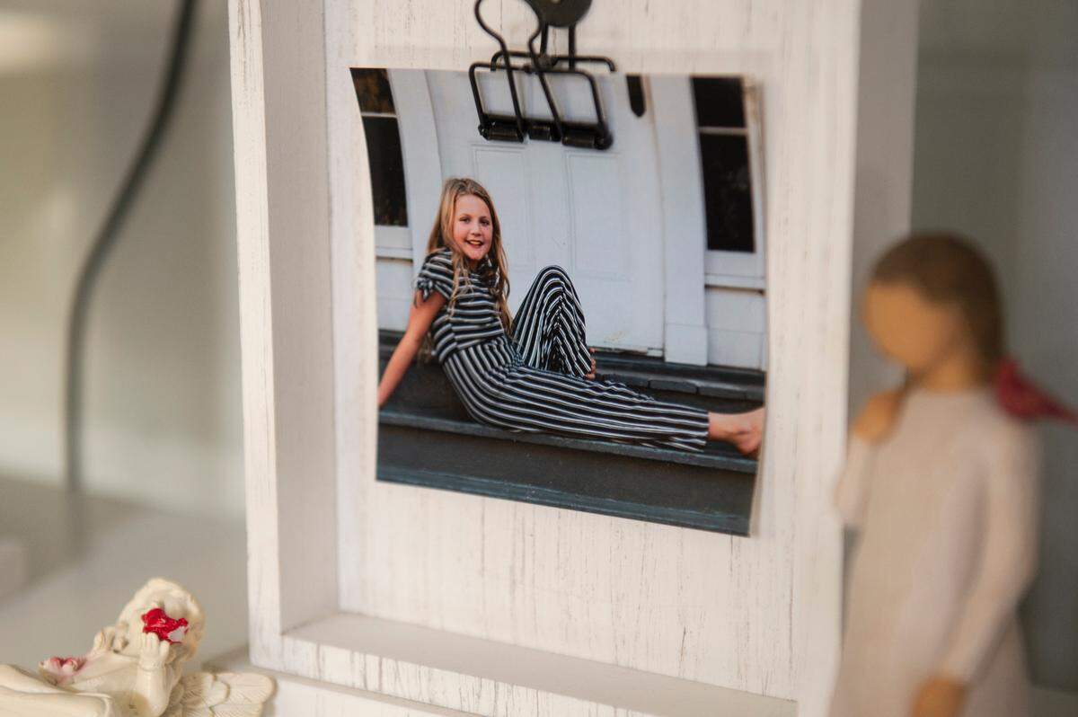 A childhood photo of Aubreigh Wyatt sits in Heather Wyatt’s home in Ocean Springs on Tuesday, March 12, 2024.