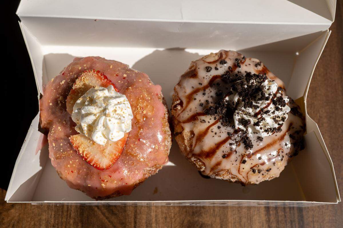 A strawberry shortcake doughnut, left, and a campfire doughnut, right, at Parlor Doughnuts on Thursday, October. 16, 2025.