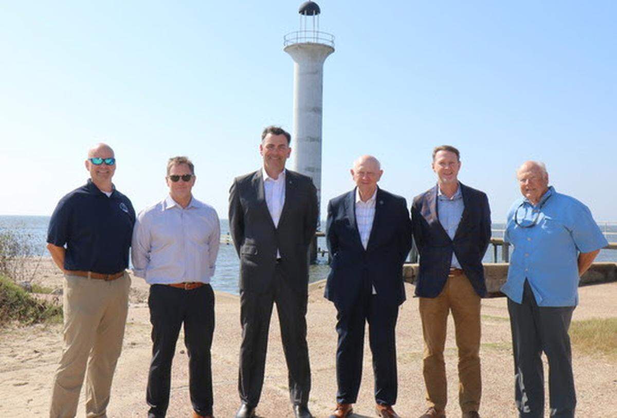 Gathered at the site of the Broadwater Marina in Biloxi are, from left: Chris Wells, executive director of Mississippi Department of Environmental Quality; Roy Anderson III, co-managing partner of Broadwater Development, owner of the Broadwater property; Secretary of State Michael Watson; General Joe Spraggins, executive director of Mississippi Department of Marine Resources; Dax Alexander, president of Brown, Mitchell & Alexander and Bob Hodges with J.E. Borries. They are working together to restore the marina.