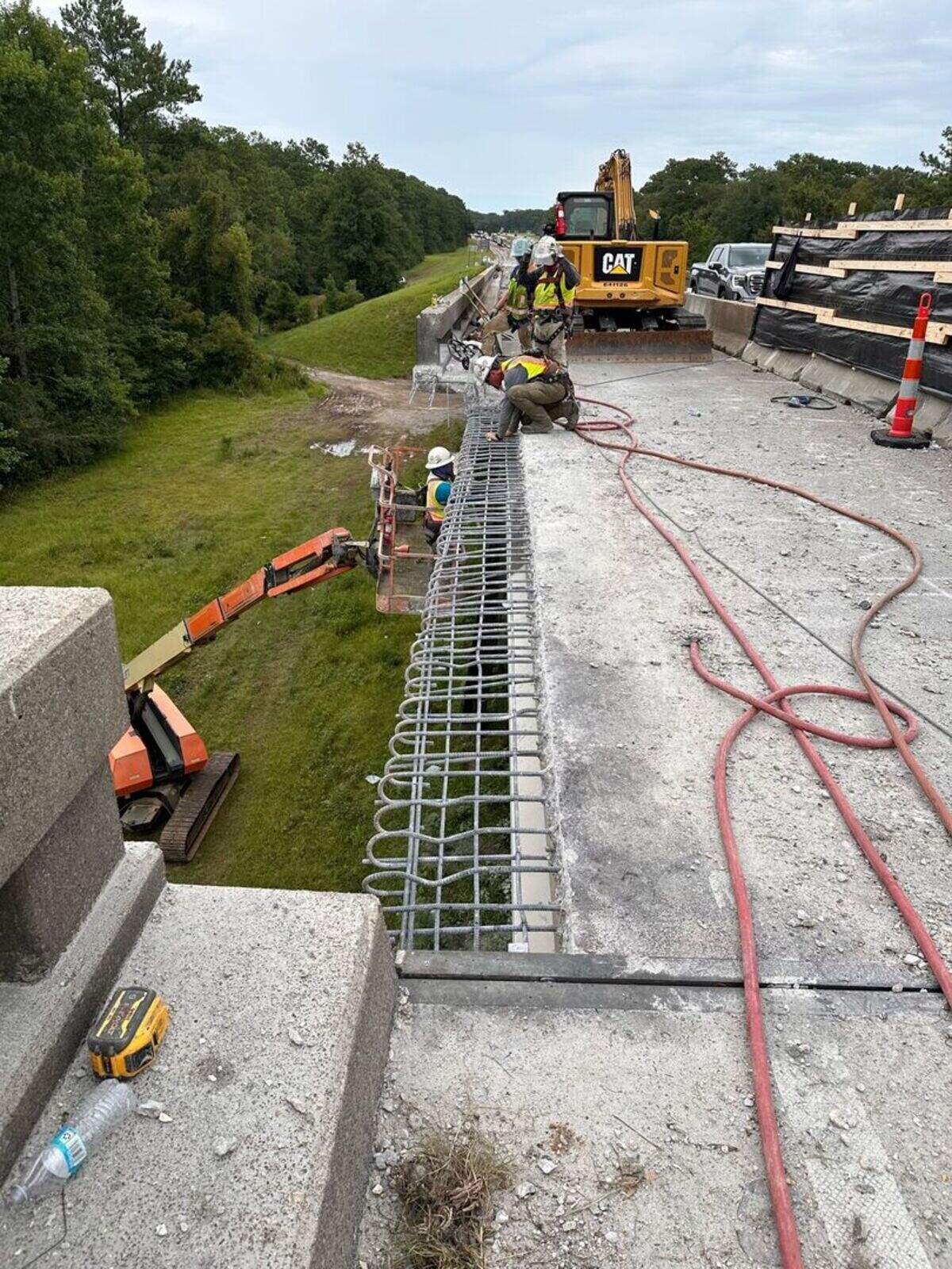 Crews work on the right line of the East Pearl River bridge on Interstate 10 near the Louisiana state line.