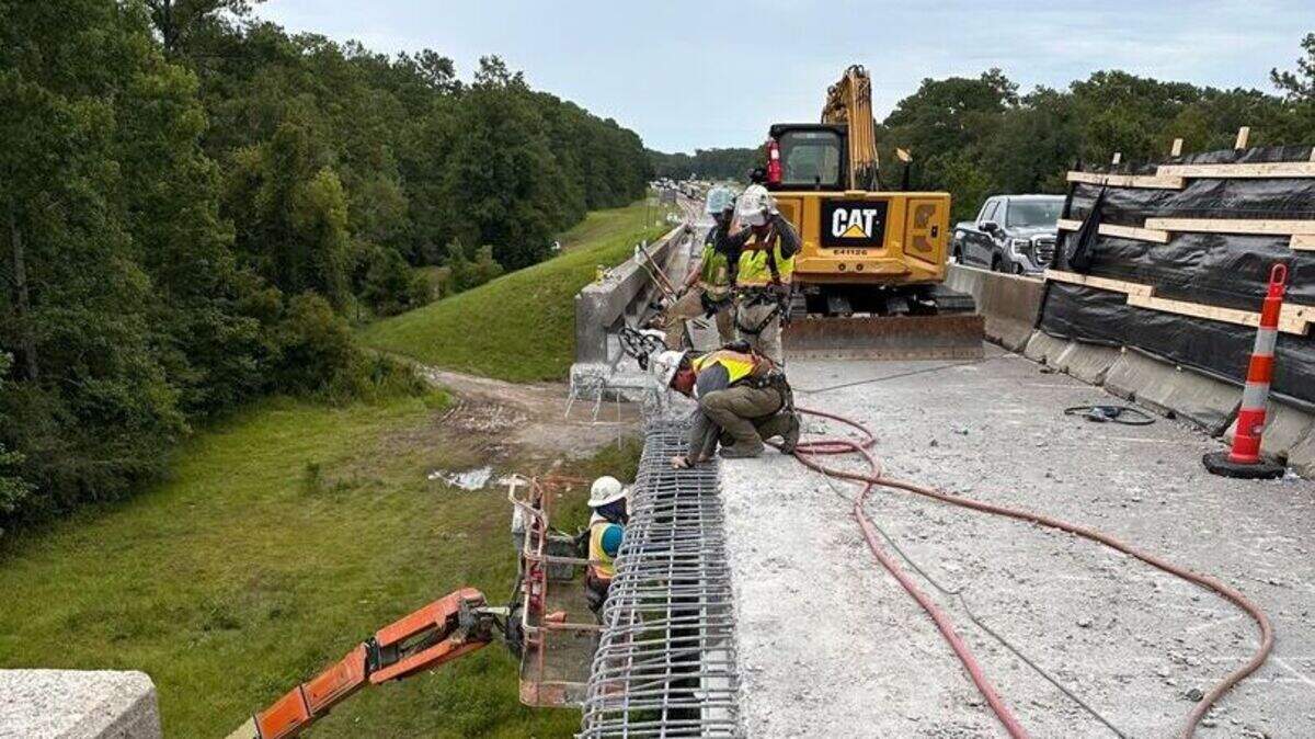 Crews work on the right line of the East Pearl River bridge on Interstate 10 near the Louisiana state line.