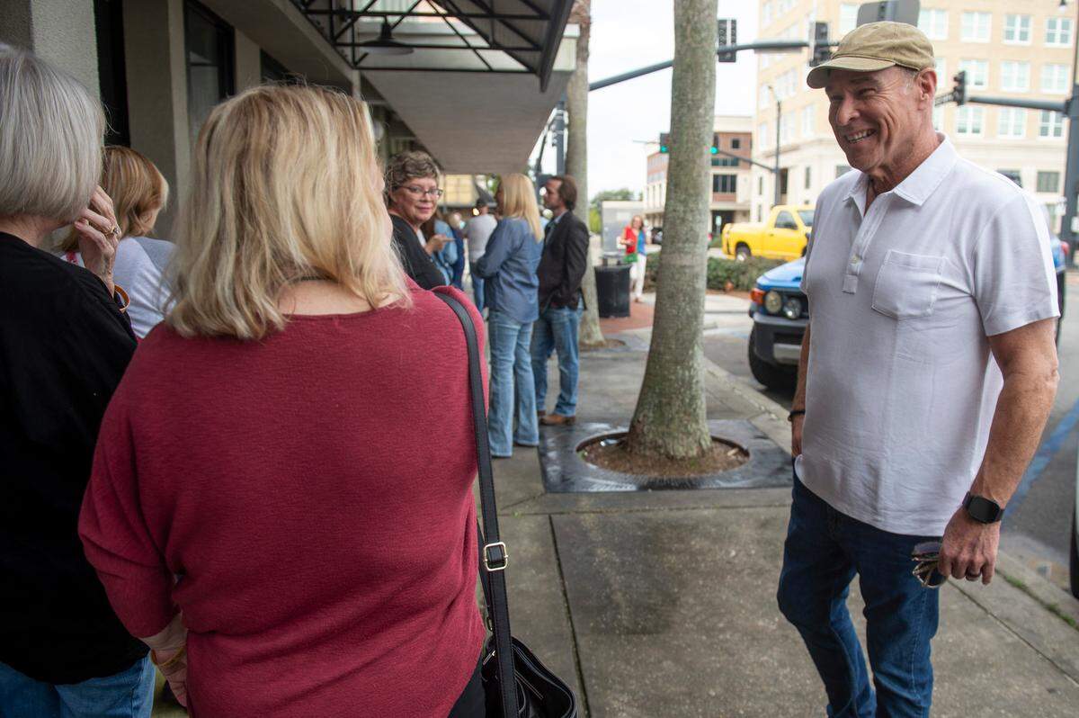 Restaurateur Robert St. John greets customers in line to buy king cakes from a Gulfport pop-up for his bakery, Loblolly Bakery, on Friday, Feb. 7, 2025.