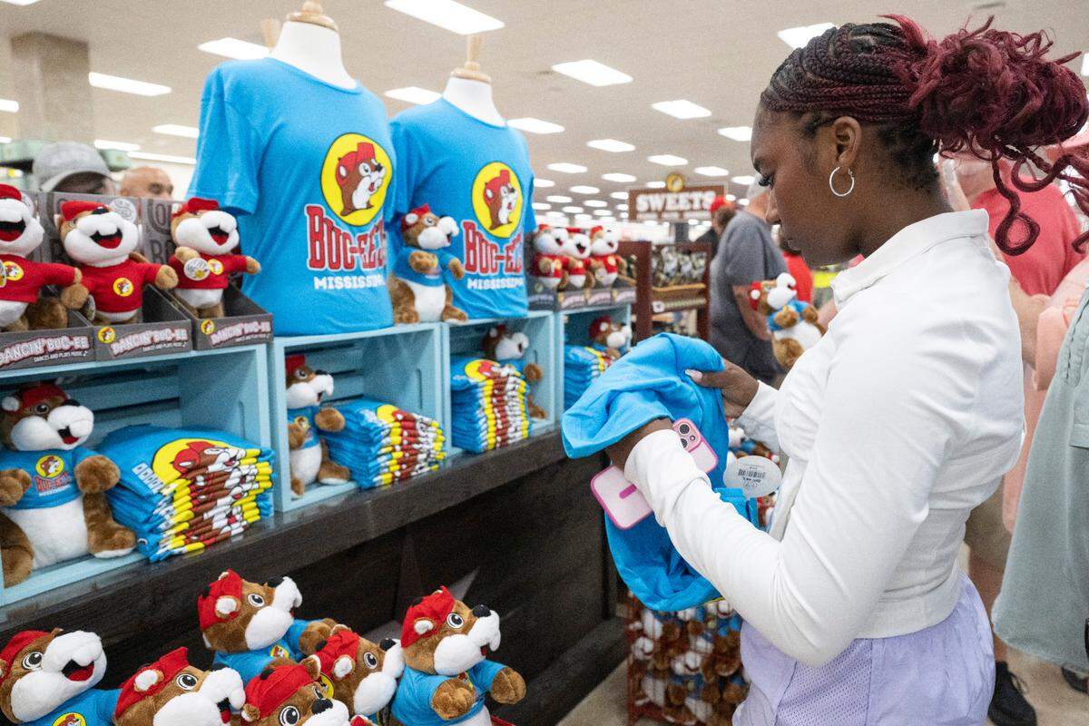 Customers shop for Buc-ee’s merchandise as the popular travel stop opened its first Mississippi location in Harrison County on Monday, June 9, 2025.