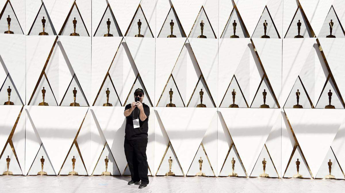Lee Roth shoots a selfie in front of the backdrop for the arrivals area for the Oscars in front of the Dolby Theatre on Wednesday, Feb. 24, 2016, in Los Angeles. The 88th Academy Awards will be held on Sunday. 