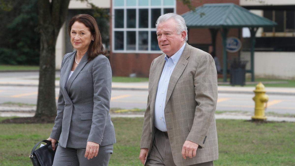 Julie and Ted Cain walk toward the federal courthouse in Gulfport in February 2020 for opening arguments in the U.S. government’s civil case against them. The government proved that the couple defrauded Medicare of millions, but the Cains have appealed the verdict.