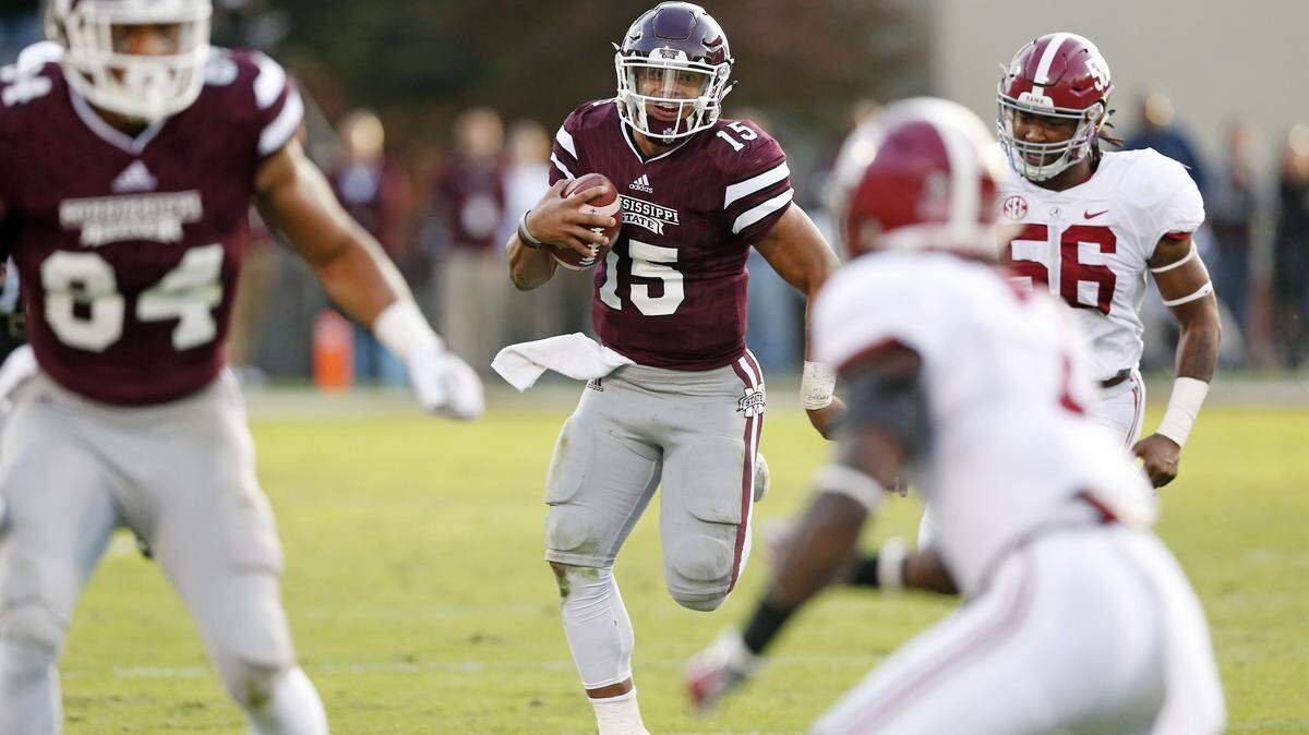 ROGELIO SOLIS/ASSOCIATED PRESS 
 Mississippi State quarterback Dak Prescott (15) tries to run against Alabama in Starkville Saturday.