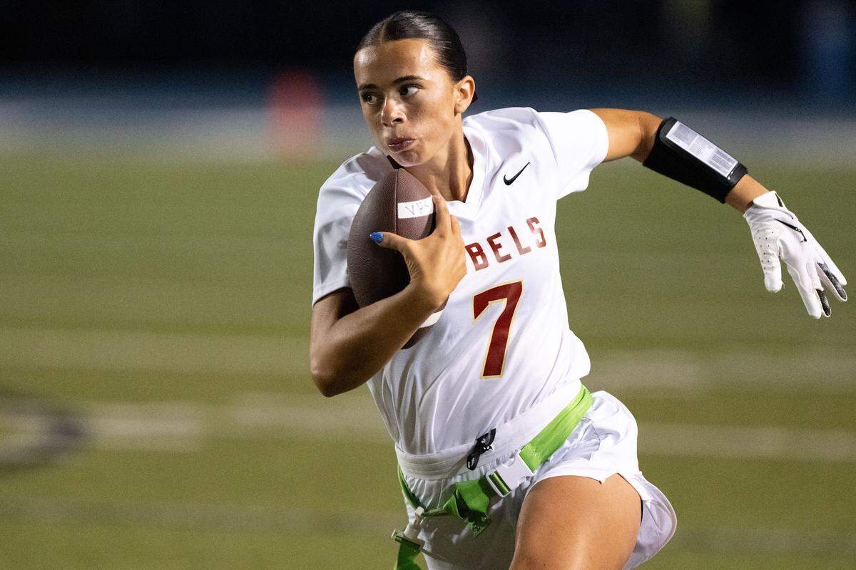 George County’s Lani McDoniel (7) scrambles with the ball during a flag football game at Vancleave on April 9.