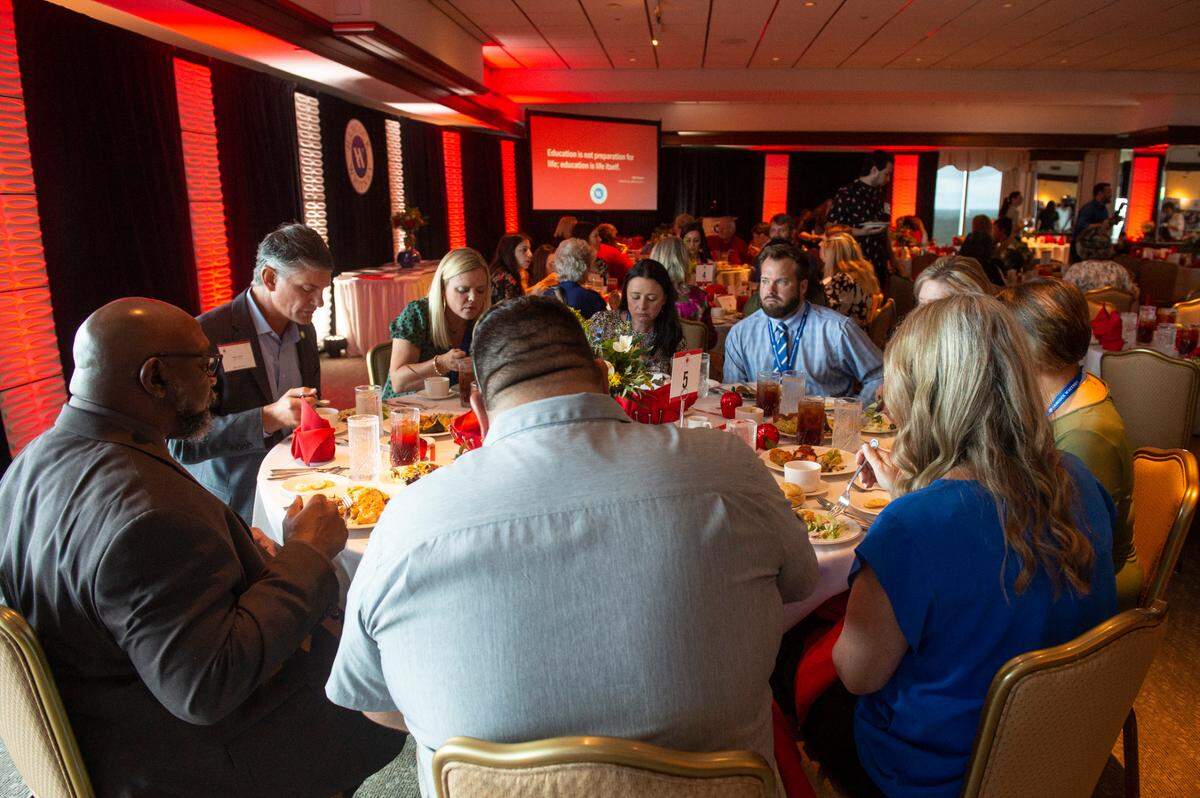 Tables full of local teachers and educators dine together during the Leo W. Seal teachers awards and grants luncheon at the Great Southern Club in Gulfport on Friday, Aug. 26, 2022. This was the first time the event was held since the coronavirus pandemic.