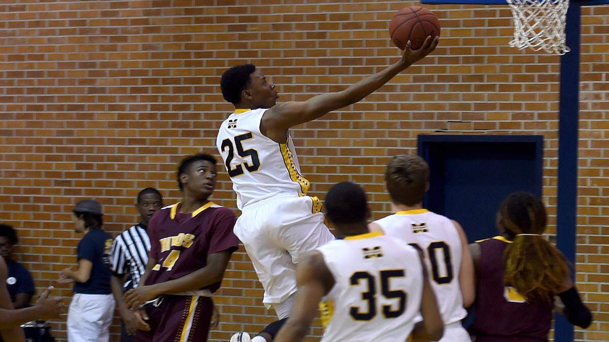 RICH KOPP/MGCCC 
 Mississippi Gulf Coast's Dylan Causwell finger rolls against Hinds on Thursday in Perkinston.