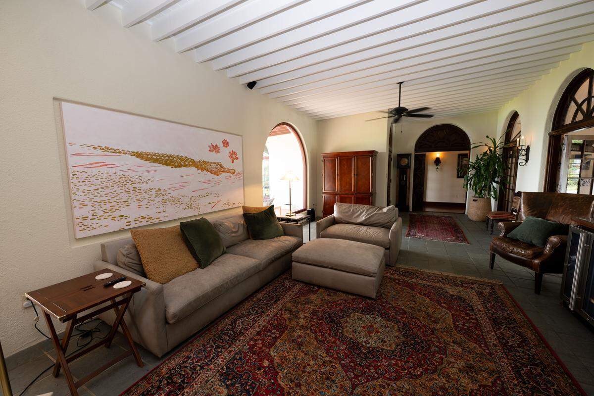 A living area that leads to two guest bedrooms and a backyard patio at Villa Del Mare at 13801 Arbor Circle in Ocean Springs on Wednesday, May 27, 2026.