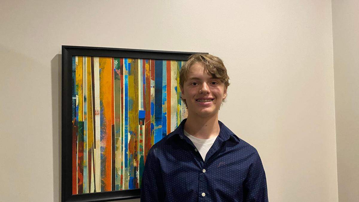 James “Jimmy” Chilimigras, 15, poses at the Knight Nonprofit Center in Gulfport before the Coast Young Professionals grant him honorary membership.