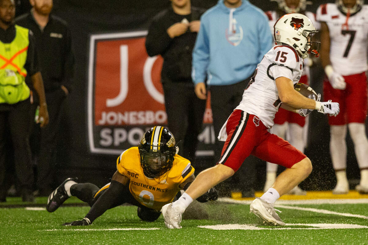 Southern Miss Golden Eagles cornerback Brendan Toles (0) tries to tackle Arkansas State Red Wolves wide receiver Reagan Ealy (15) during a game between Southern Miss and Arkansas State at M.M. Roberts Stadium in Hattiesburg on Saturday, Oct. 19, 2024.